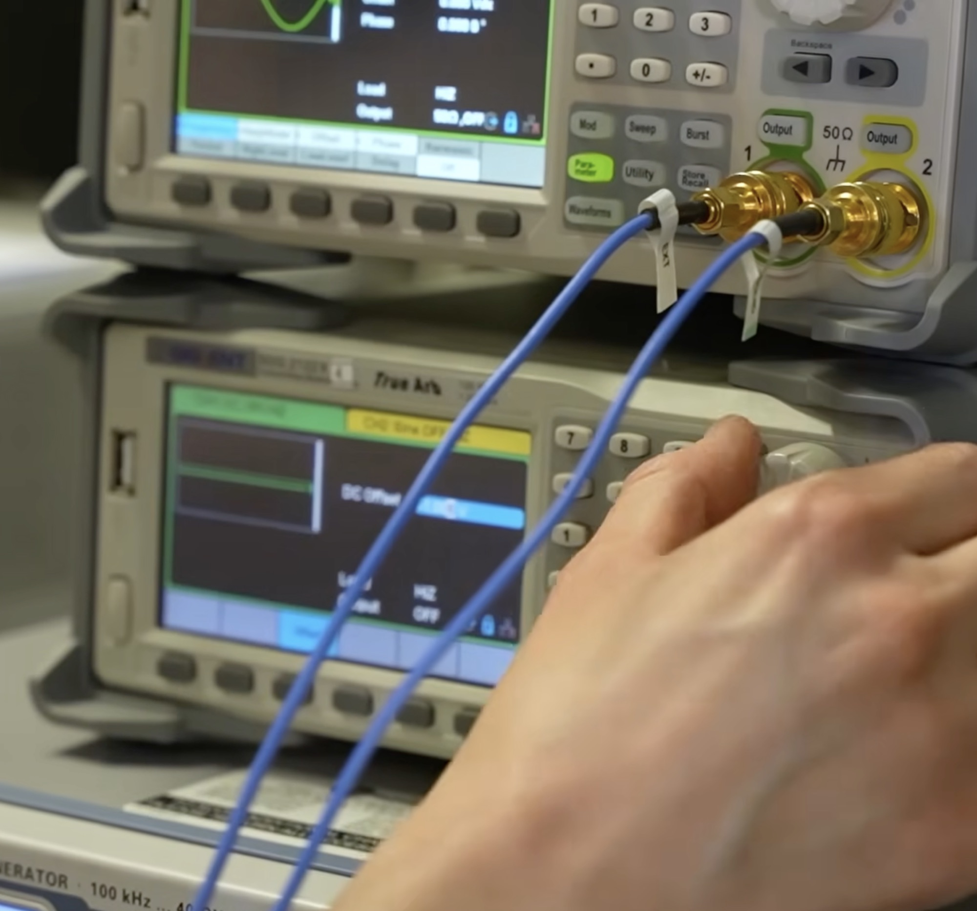 Close-up of an Anyon technician making adjustments to a superconducting processor